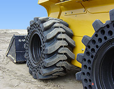 Flat-proof tires for skid steers, backhoes, and telehandlers
