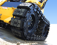 Over-the-tire tracks for skid steer loaders
